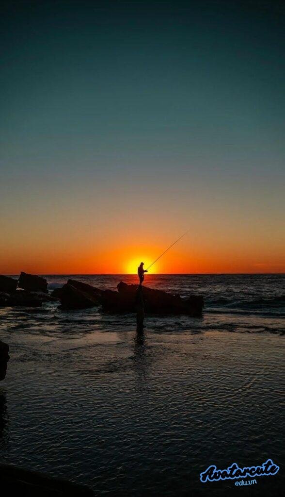 hình nền người câu cá lúc hoàng hôn hd